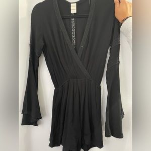 Black romper with lace detailing.